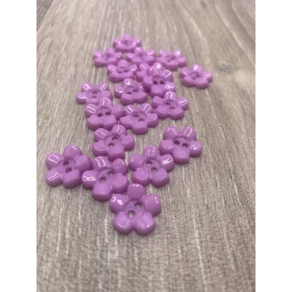 Lilac flower-shaped buttons.