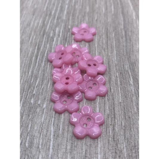 Pink flower-shaped buttons.