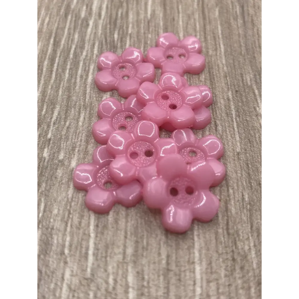 Pink flower-shaped buttons.