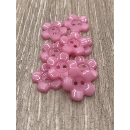 Pink flower-shaped buttons.