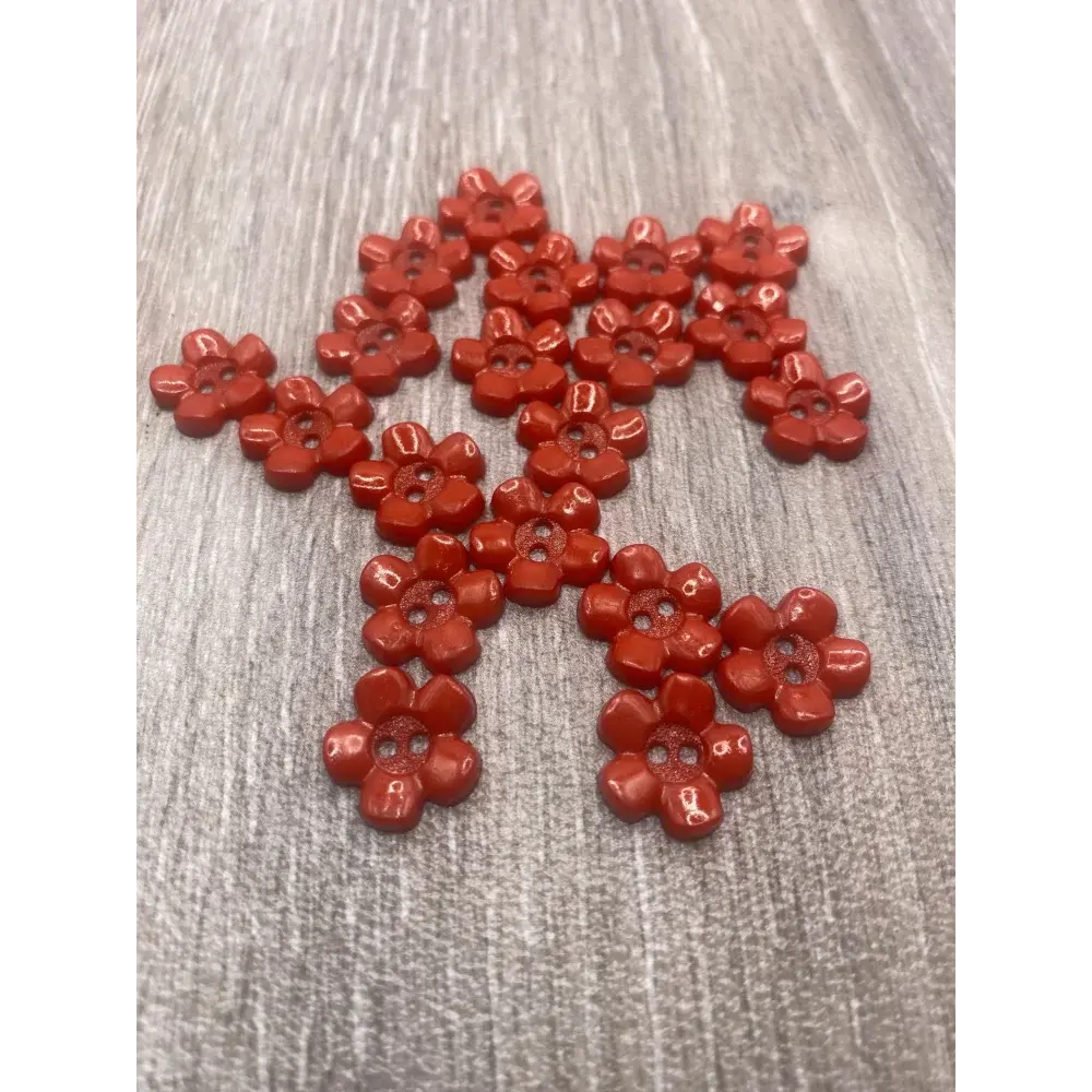 Red flower-shaped buttons.