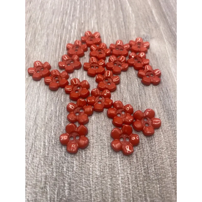 Red flower-shaped buttons.