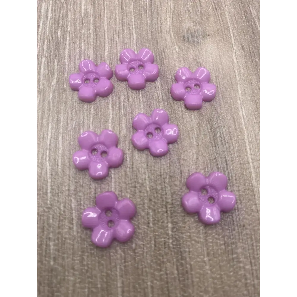Seven lavender flower buttons.