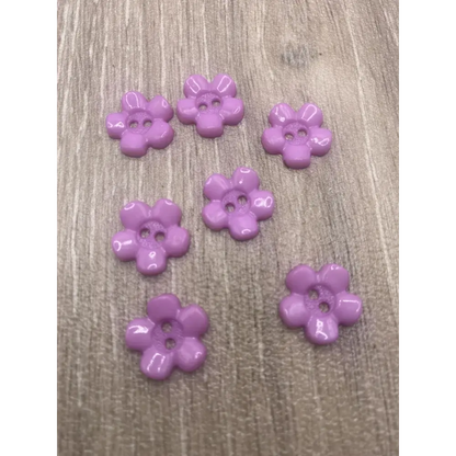 Seven lavender flower buttons.