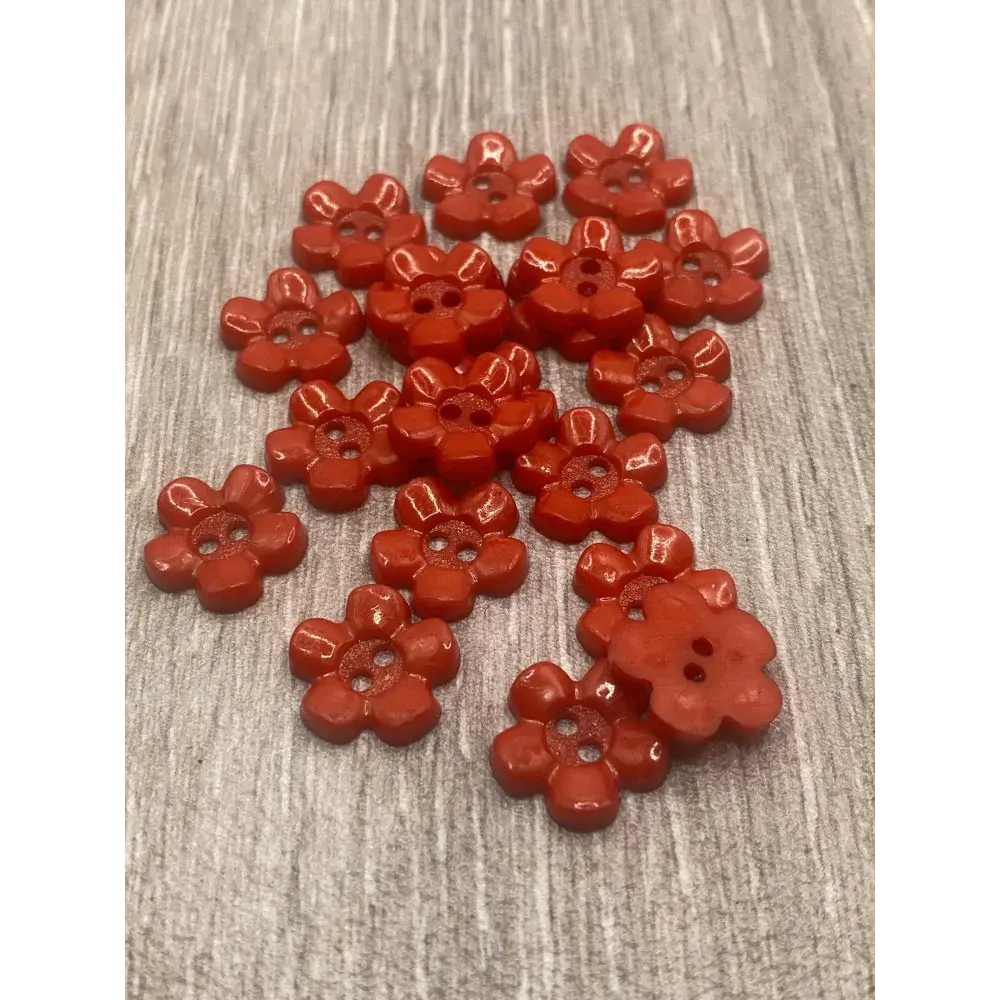 Red flower-shaped buttons.