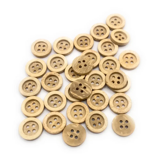 Pile of four-hole wooden buttons.