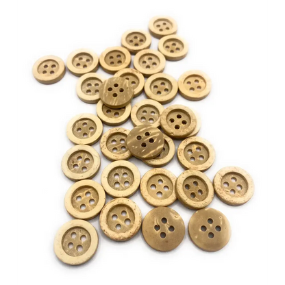Pile of four-hole coconut buttons.