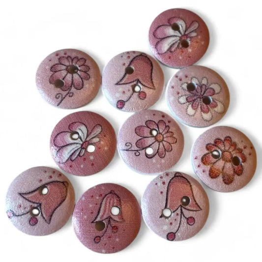 Round, pink wooden buttons with floral designs.