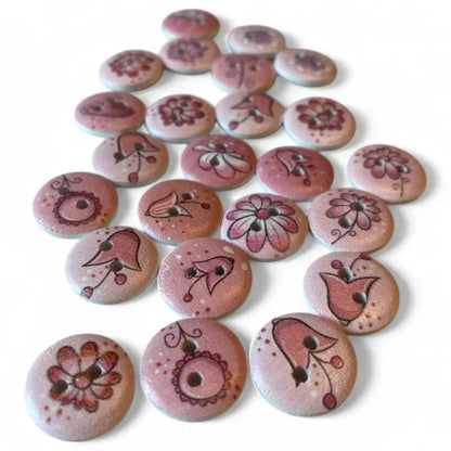 Collection of pink floral-patterned wooden buttons.