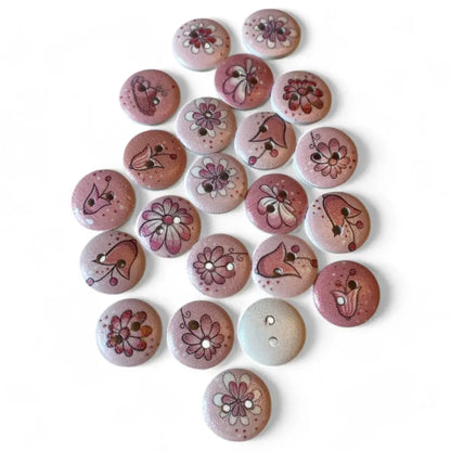 Round, pink, floral-patterned wooden buttons.