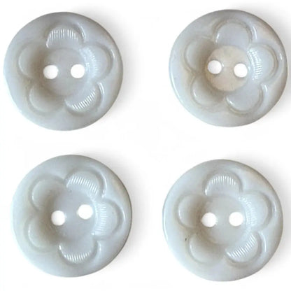 Four flower-shaped, two-hole buttons.