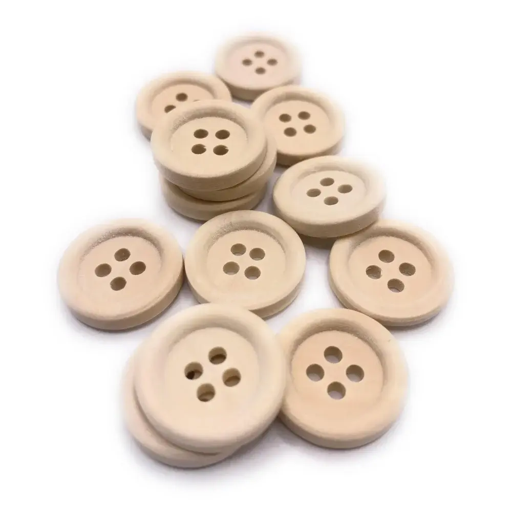 Pile of round, four-hole wooden buttons.