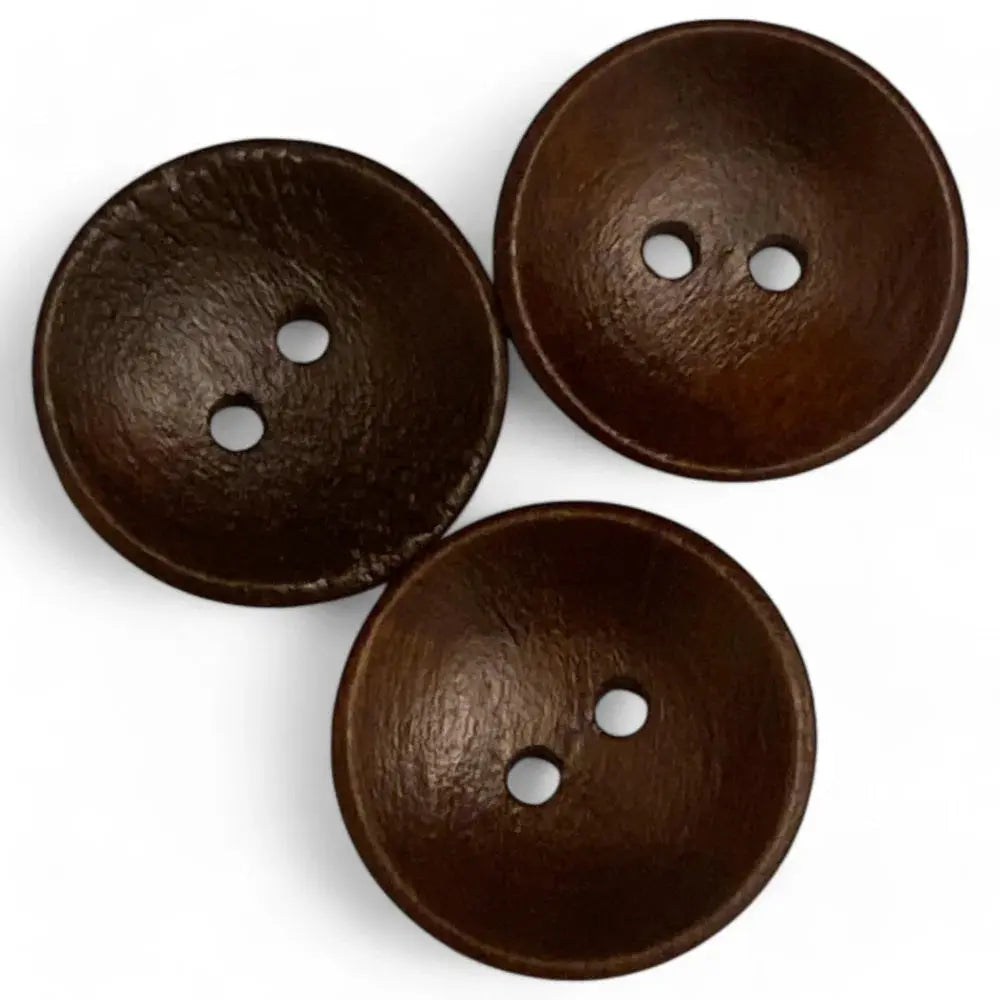 Three brown, two-hole buttons.