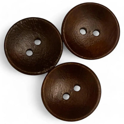 Three brown coconut buttons.