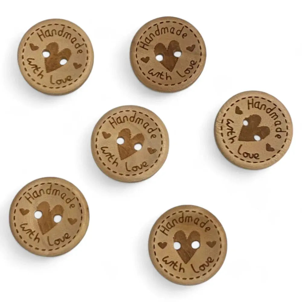 Round wooden buttons with heart design.