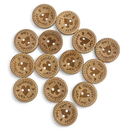 Round, brown, wooden buttons with heart design.