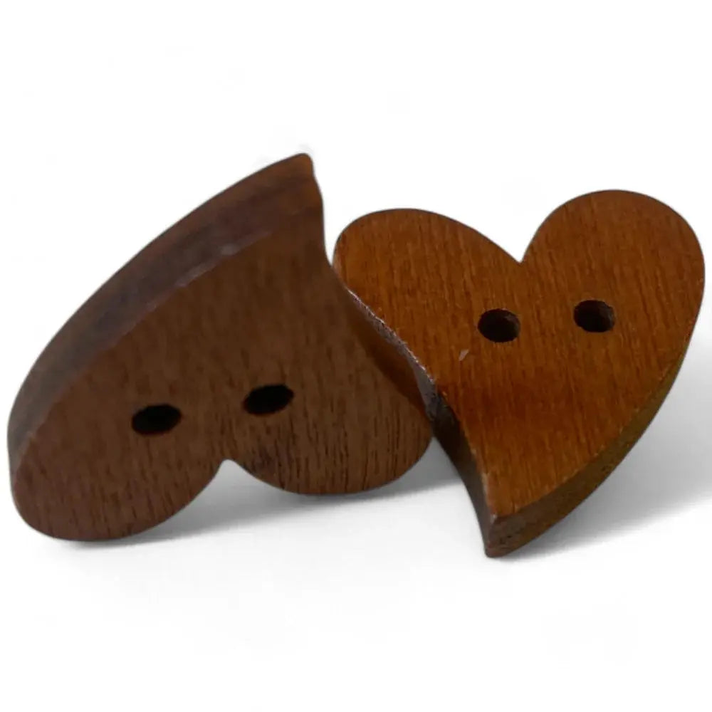 Two wooden heart-shaped buttons.