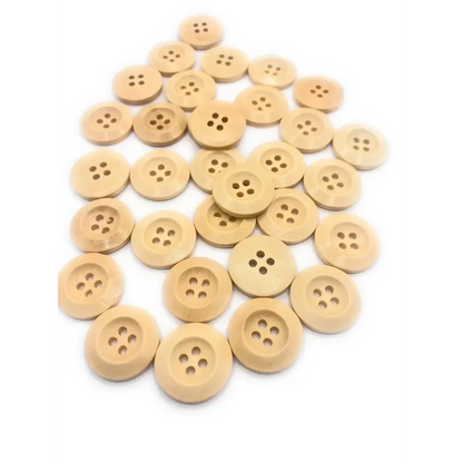 Pile of four-hole wooden buttons.