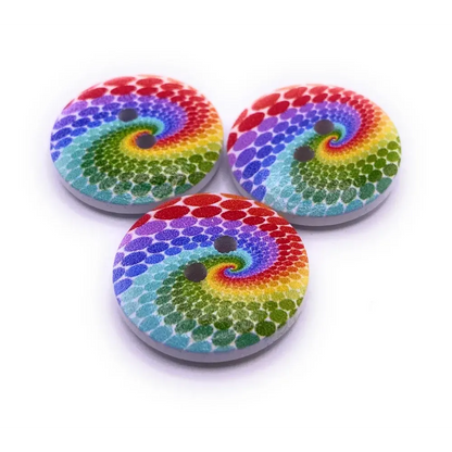 Three rainbow swirl buttons.