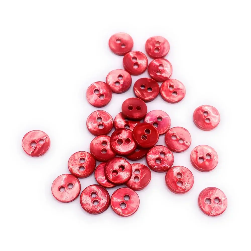 Pile of red, two-hole buttons.