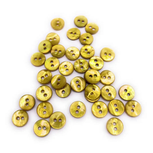 Pile of iridescent yellow buttons.
