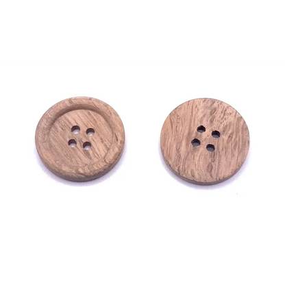 Two round, four-hole wooden buttons.