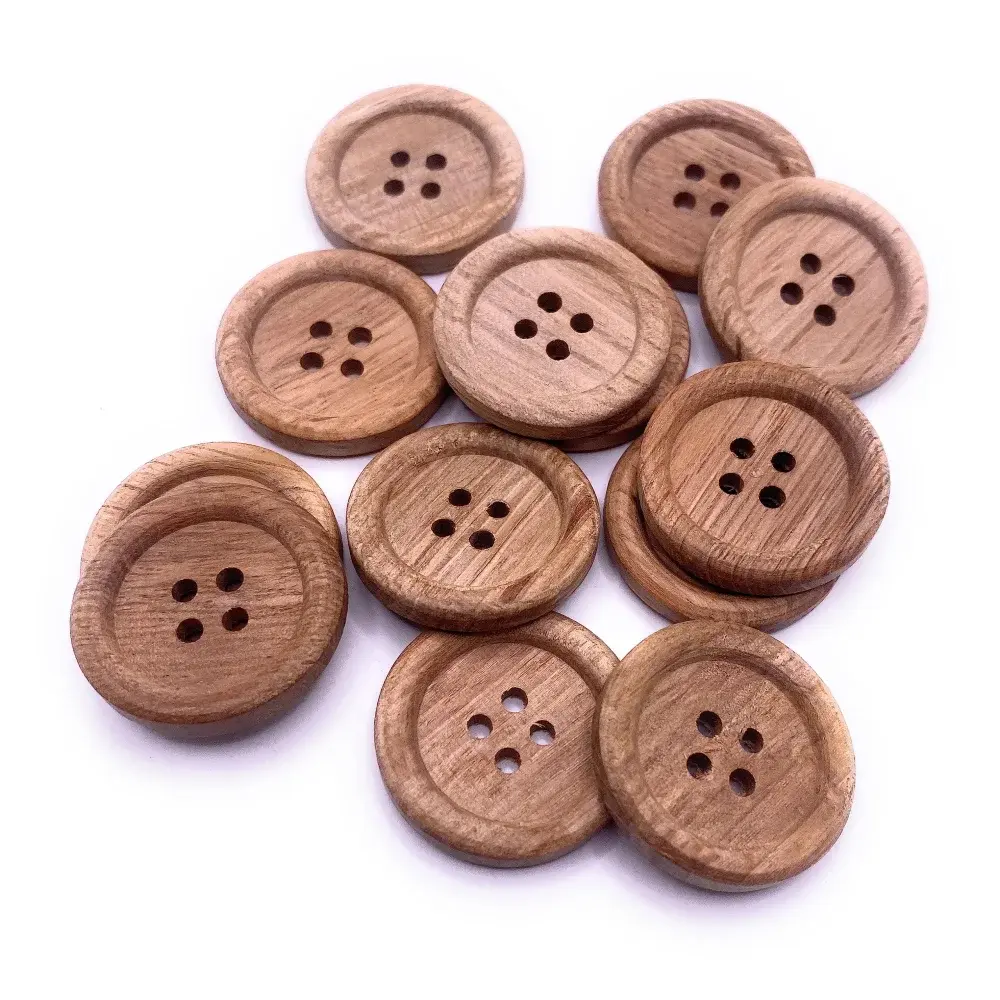 Pile of round wooden buttons.