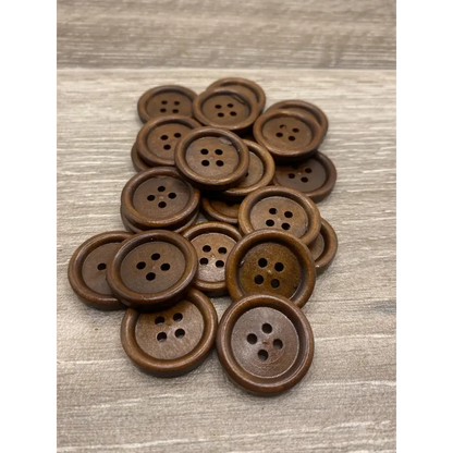 Pile of brown, four-hole buttons.