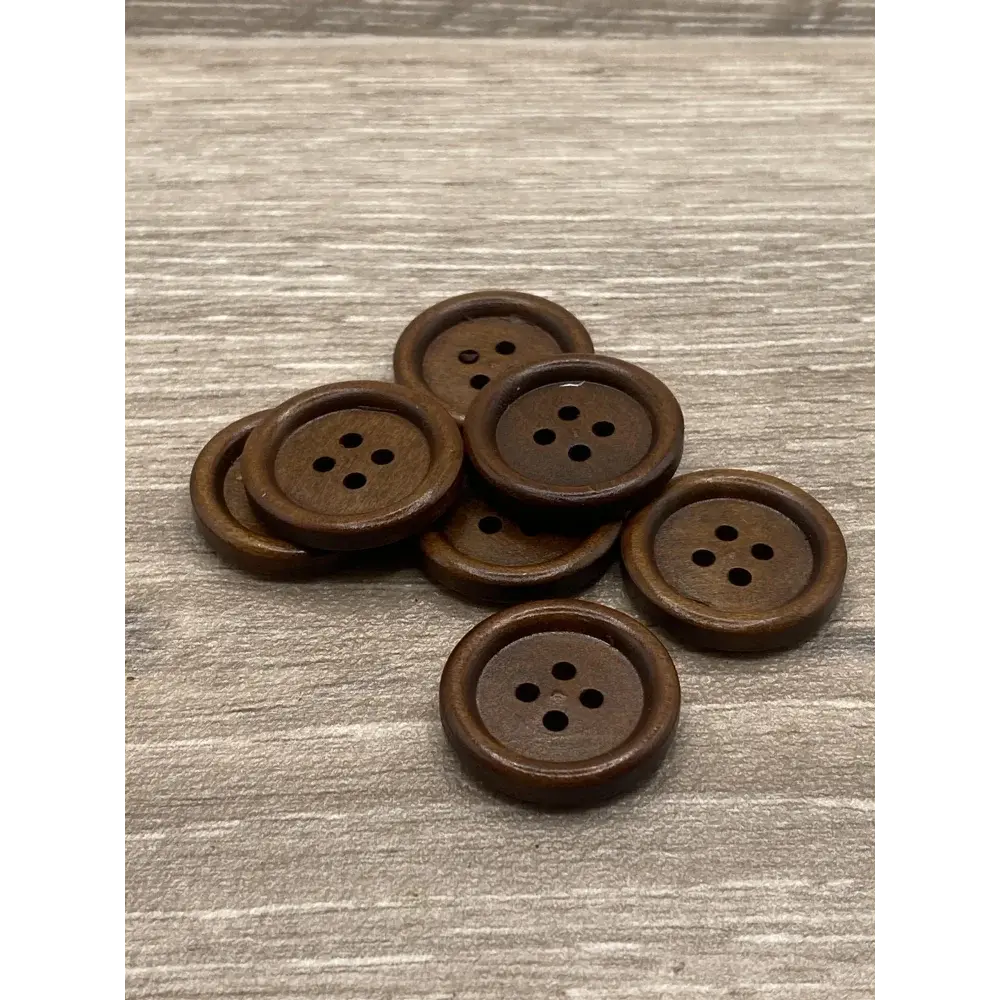 Brown wooden four-hole buttons.