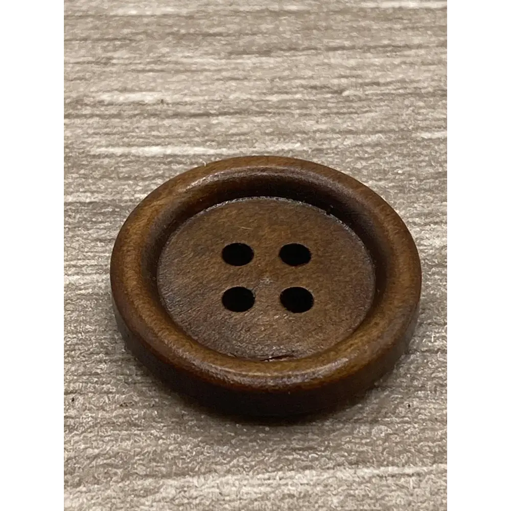 Round, brown, four-hole wooden button.
