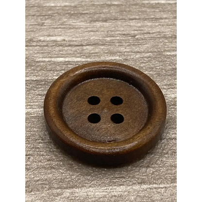 Round, brown, four-hole wooden button.