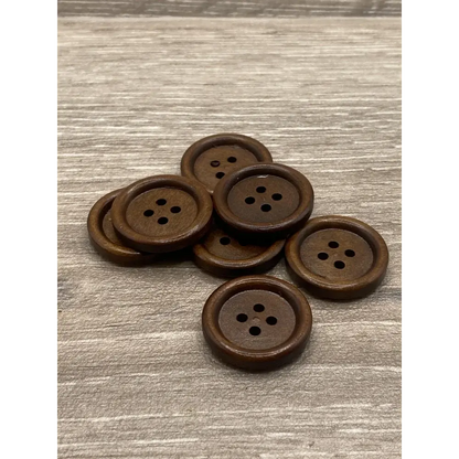 Brown wooden four-hole buttons.