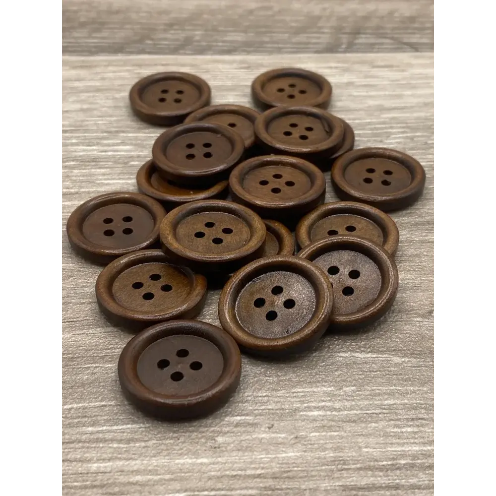 Pile of brown wooden buttons.