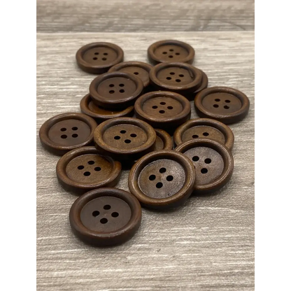 Pile of brown wooden buttons.