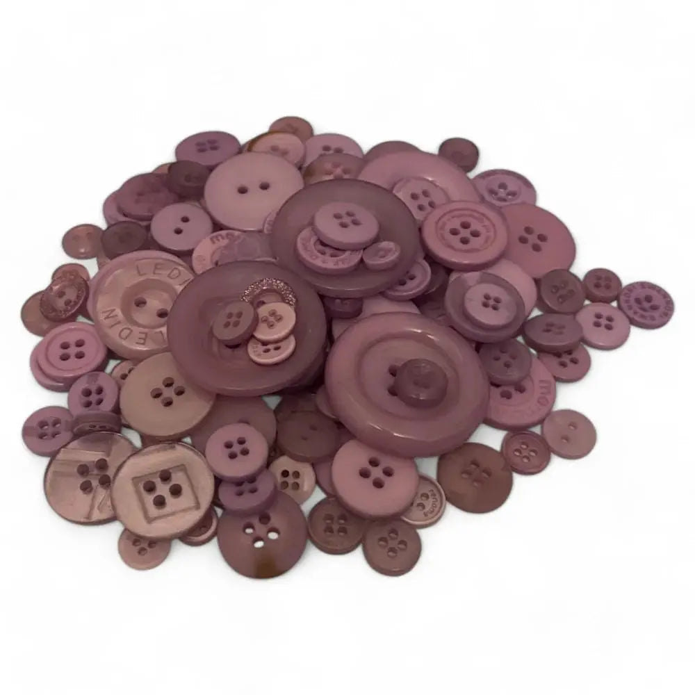 Pile of mauve-colored buttons.