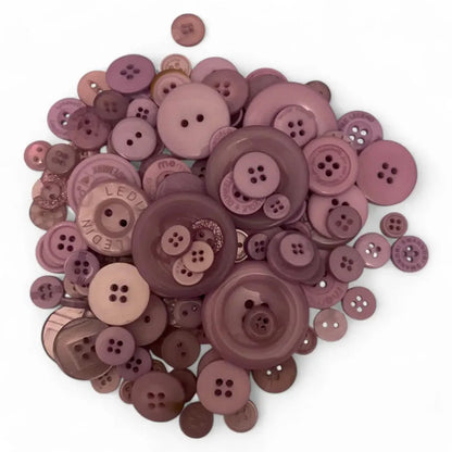 Pile of mauve buttons.