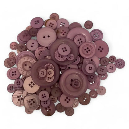 Pile of mauve-colored buttons.