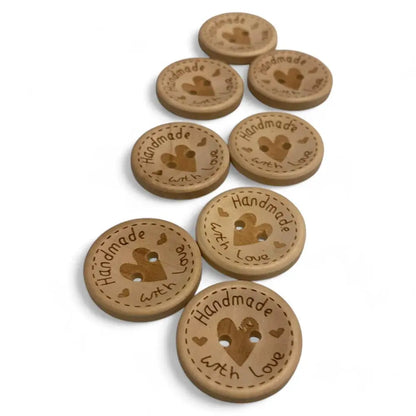 Wooden craft buttons with heart design.