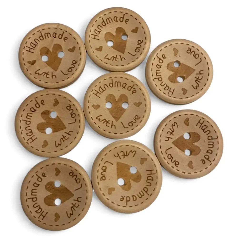Round, wooden buttons with heart-shaped holes.