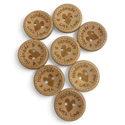 Wooden craft buttons with heart-shaped holes.