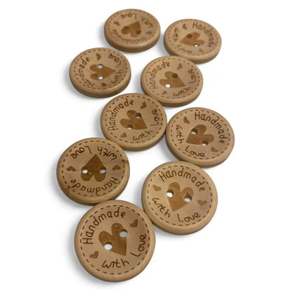 Wooden craft buttons with heart-shaped holes.