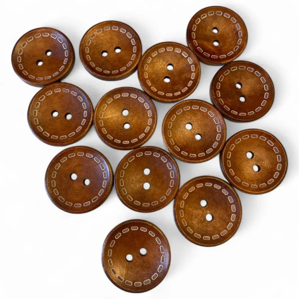 Round, brown, wooden buttons with decorative stitching.