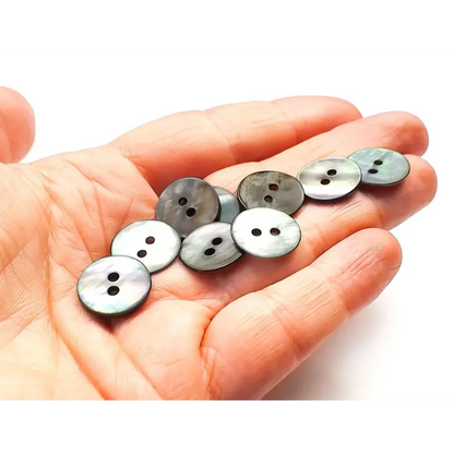 Mother-of-pearl two-hole buttons.