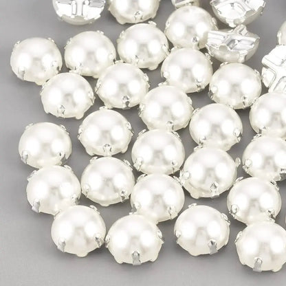 White pearl cabochons with silver settings.