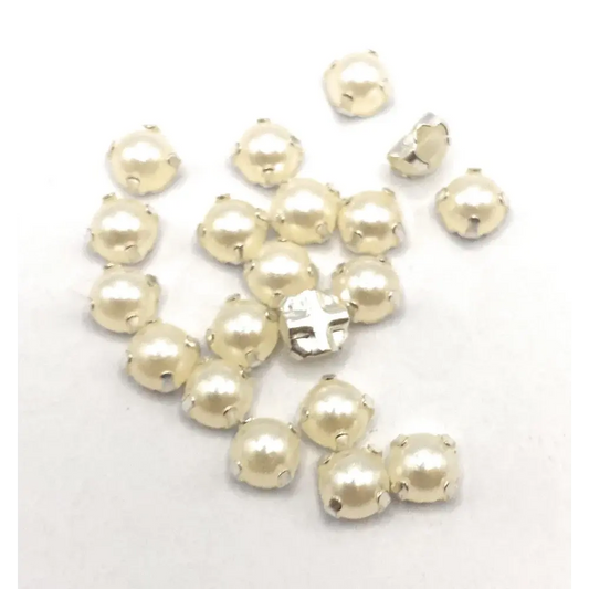 Creamy pearl-like beads with silver settings.