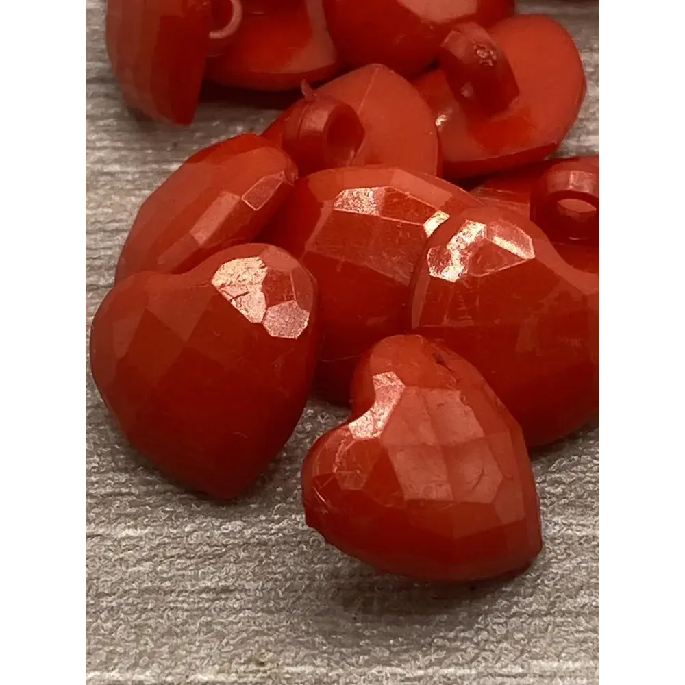 Red faceted heart buttons.