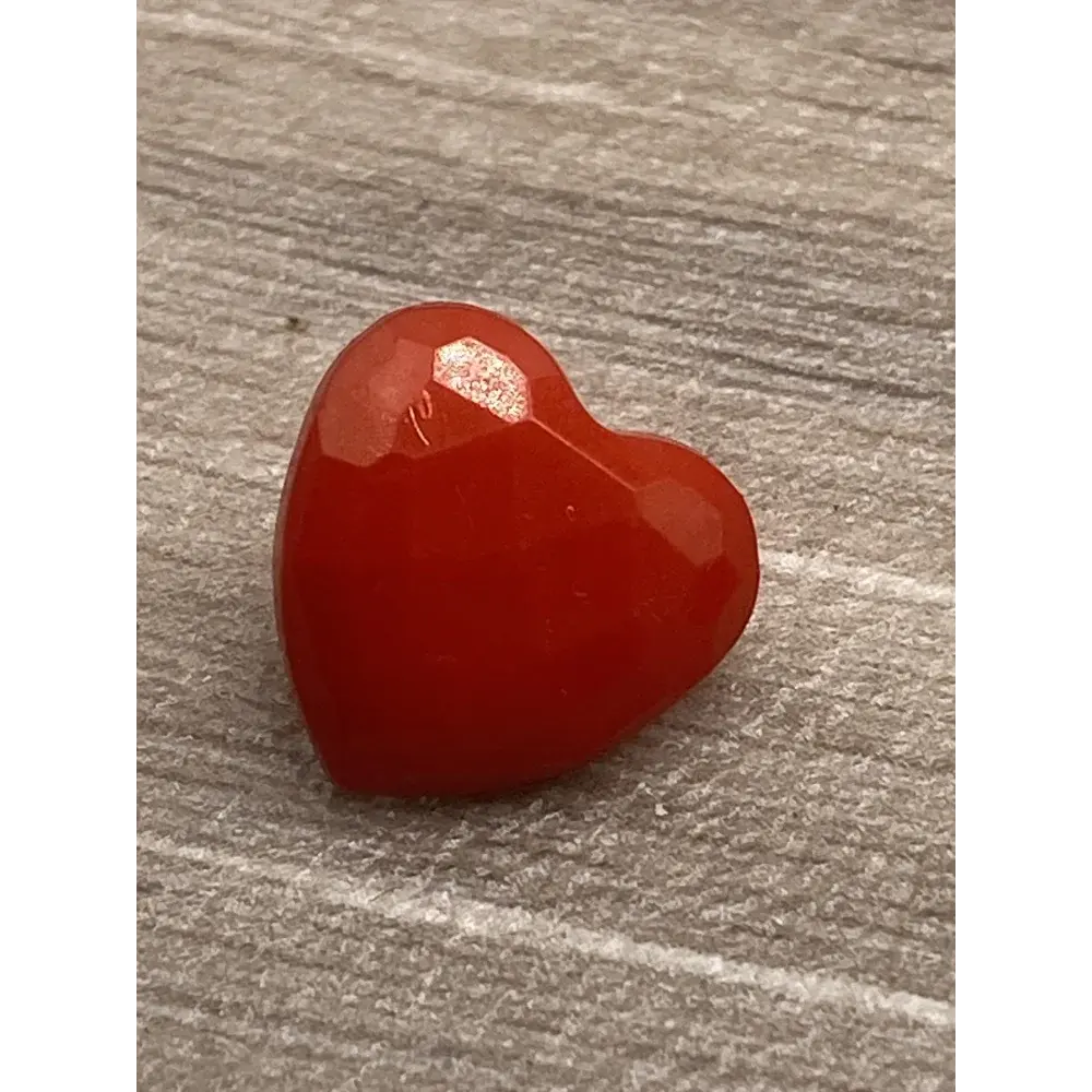 Red heart-shaped gemstone.