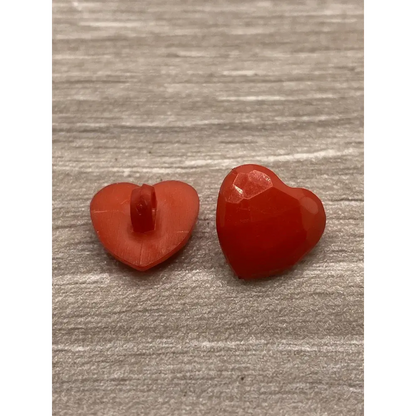 Two red heart-shaped buttons.