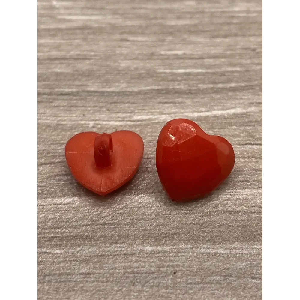 Two red heart-shaped buttons.