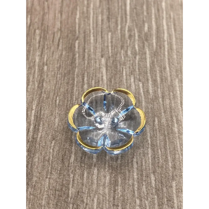 Blue glass flower trinket dish with gold trim.
